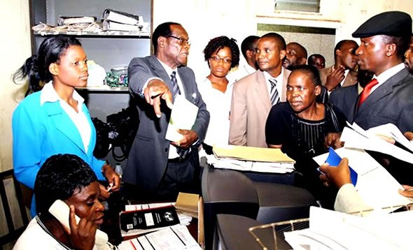 Mugabe's trusted election rigger: Registra General Tobaiwa Mudede (in glasses)