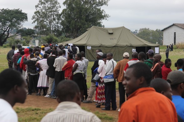 Residents of Mbare queue to vote in the Referendum in the early hours of Saturday 16 March.