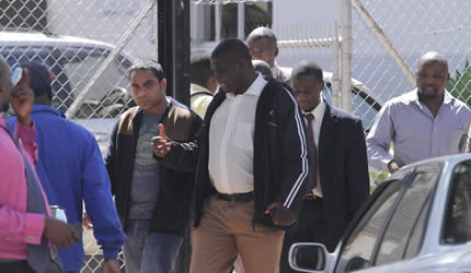 Prominent Mutare lawyer Chris Ndlovu and businessman Mudassar Khan being escorted to court by CID details on Wednesday