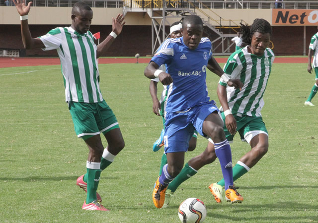 Dynamos wingback, Godknows Murwira, streaks clear of three CAPS United players (from left) Ronald Pfumbidzai, Moses Mucheche and George Nyirenda during the Harare Derby at the National Sports Stadium