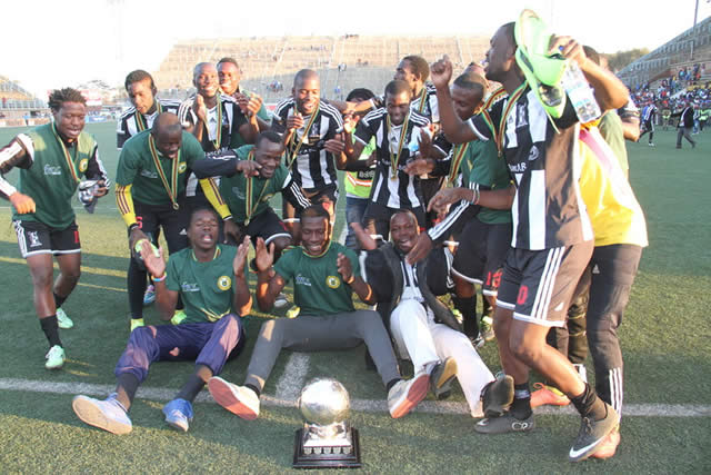 PARTY TIME . . . Highlanders players celebrate their triumph in the Commander Zimbabwe National Army Charities Shield final at Rufaro yesterday
