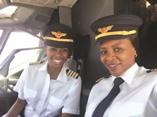 Captains Chipo Matimba (right) and Elizabeth Simbi Petros smile for the cameras before take-off at Harare International Airport en route to Victoria Falls yesterday