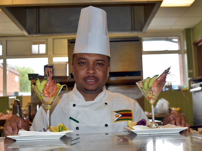 Zimbabwean chef currently based in London Chef Genias Mupfayi says being a chef is family legacy, as he poses with Prawn Cocktail.