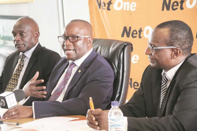 NetOne board chairman Mr Alex Marufu (centre) addresses a Press briefing in Harare yesterday. He is flanked by board member Mr Shepherd Tsomondo (left) and acting chief executive officer Mr Brian Mutandiro. (Picture by Justin Mutenda)