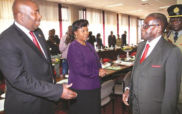 President Mugabe talks to Local Government, Public Works and National Housing Minister Saviour Kasukuwere while Environment, water and Climate Minister Oppah Muchinguri-Kashiri looks on during a Politburo meeting in Harare yesterday. — (Picture by John Manzongo)