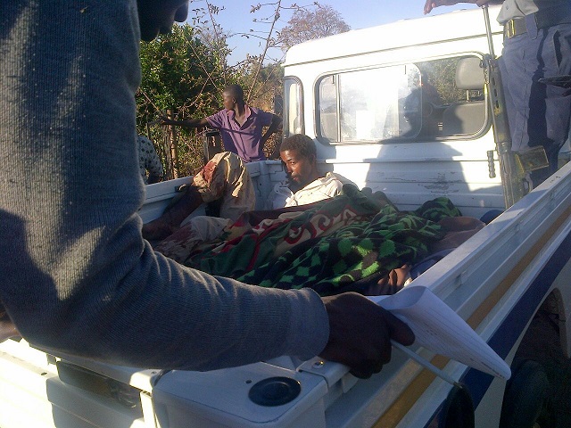 Macala Tavengwa Chituso and the bodies of his victims in a police truck