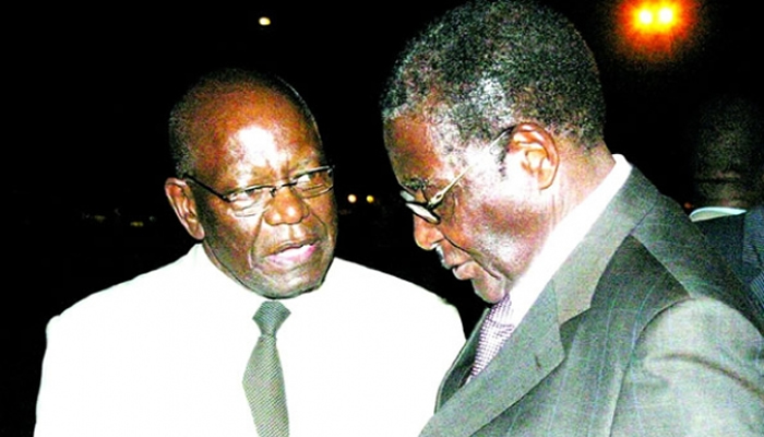 Mutasa seen here with President Mugabe in happier times