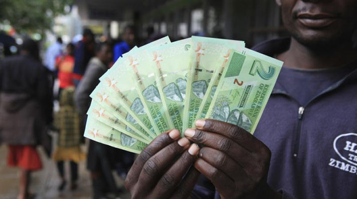 Zimbabwe launches "bond notes" currency in bid to ease cash crunch