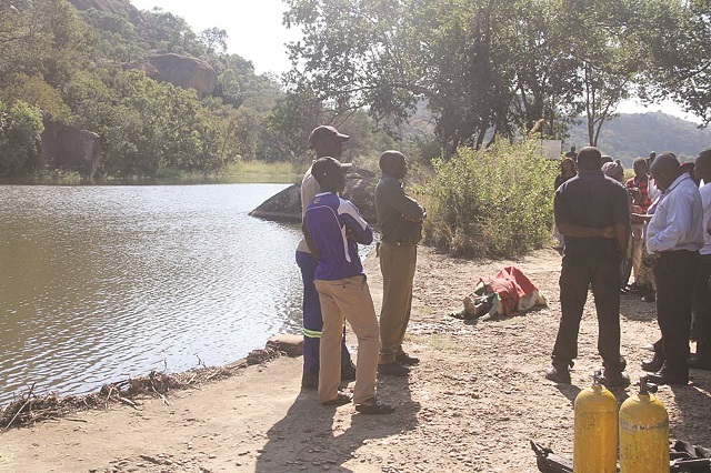 Some of the people who witnessed the retrieval of the late Tichawona Nyamande’s body from Maleme Dam inside Matopo National Park on Monday