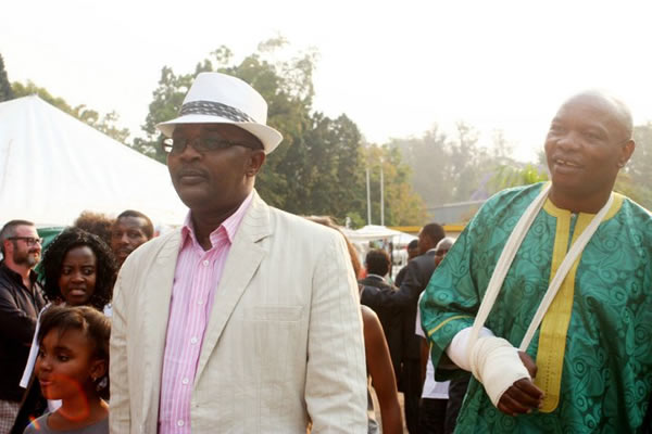karikoga-kaseke with walter-mzembi-600 Minister Mzembi (left) seen here with an injured Kaseke, who had just survived a car crash in which he was travelling with some models to Kariba