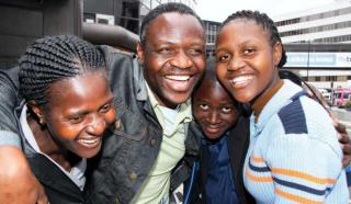 Wonder Maruma, with wife Lilian, daughter Rejoyce and son Reward. ‘I never thought this day would come,’ said Rejoyce after the family were reunited at Manchester Airport