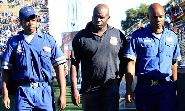 Nation-Dube-ambulance-crew Hwange FC coach Nation Dube escorted by ambulance crew at Rufaro Stadium