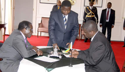 President Mugabe swears-in Transport, Communication and Infrastructural Development Deputy Minister Morgan Komichi at State House in Harare 