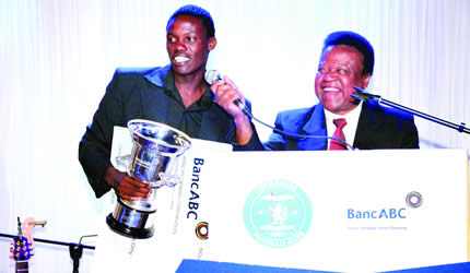 GLAMOUR BOYS . . . Dynamos’ Player of the Year midfielder Denver Mukamba (left) shares a lighter moment with popular commentator Charles Mabika during the club’s end-the-year awards ceremony in Harare last Friday night