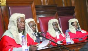 Chief Justice Godfrey Chidyausiku officially opens the 2013 legal year at the High Court in Harare yesterday. Looking on (from left) are Justices Charles Hungwe, Samuel Kudya and Hlekani Mwayera