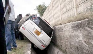 This stolen Toyota Raum in which a police detective was shot dead, landed into a ditch in Sunningdale, Harare, yesterday during a high-speed chase. The robber reportedly made off with a car belonging to the owner of the damaged vehicle.— (Picture by Aaron Nyamayaro)