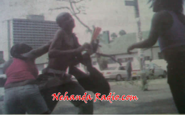 A BATTERED TAWANDA ATTEMTS TO ESCAPE