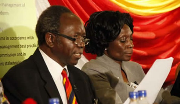 Zec Chief Elections Officer, Lovemore Sekeramayi announces the referendum results while Zec Chairperson, Justice Rita Makarau looks on