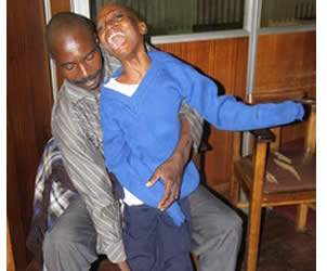 Mr Godfrey Karonga and his son Tinashe who required financial assistance to buy a V3 machine needed for his condition.