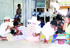 Wives of the National Railways of Zimbabwe workers demonstrated against their husbands’ unpaid salaries at the railway offices in Bulawayo. The picture shows the women crying before they were addressed by management