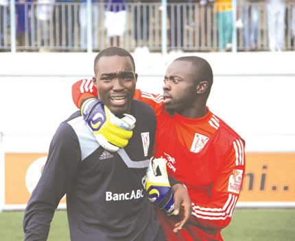 TEARS FROM THE HEART . . . Highlanders goalkeeper Munyaradzi Diya (left) gets consolation from teammate Ariel Sibanda as he failed to control his emotions at the end of yesterday’s match at Rufaro