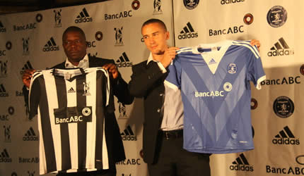 DEAL DONE . . . Adidas officials Bob Maphosa (left) and GP Sangiorgio display the new Highlanders and Dynamos kits in Harare