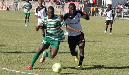 Fifty-fifty . . . Highlanders captain Innocent Mapuranga tussles for the ball with FC Platinum striker Nelson Maziwisa at Mandava yesterday — Picture by Paul Mundandi