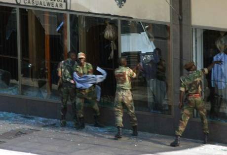 Junior soldiers seen here rampaging across Harare in 2008 while venting their anger at their suffering in the country's economic collapse under the Zanu PF regime.
