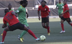 Peter Moyo surrounded by Mozambique players on Sunday