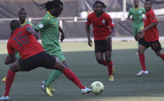 Peter Moyo surrounded by Mozambique players on Sunday Peter Moyo surrounded by Mozambique players on Sunday