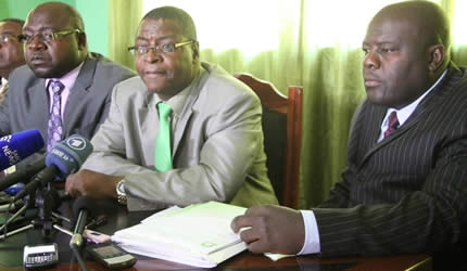 Welshman Ncube addresses the media flanked by his deputy Edwin Mushoriwa (right) and chairman Goodrich Chimbaira