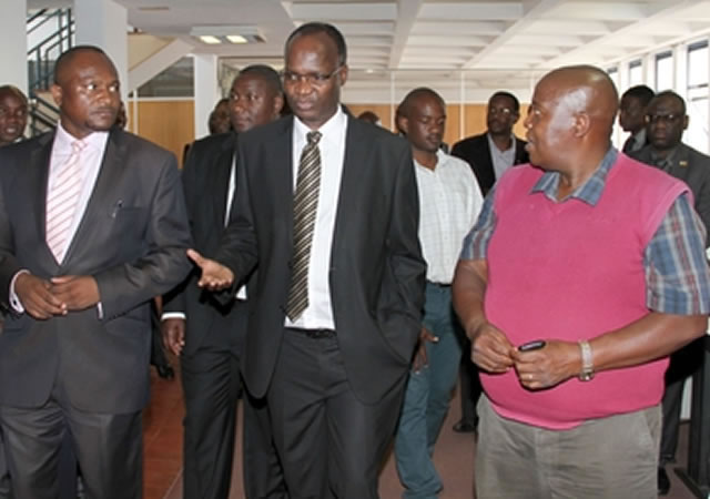 Professor Jonathan Moyo, flanked by ZBC General Manager News Tazzen Mandizvidza (left) and Political Correspondent Reuben Barwe, during a tour of ZBC Pockets Hill Studios