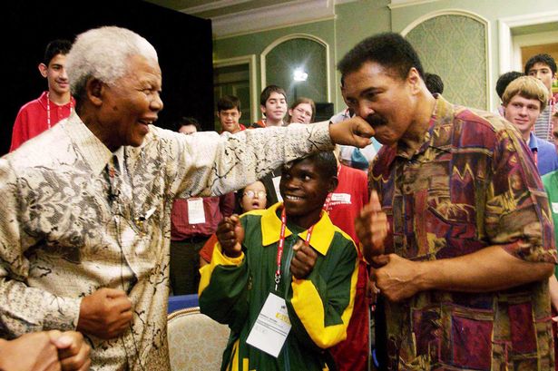 Nelson Mandela shares a lighter moment with legendary boxer Muhammad Ali