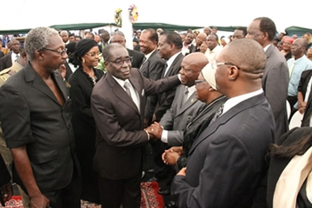 President Mugabe and the First Lady Amai Grace Mugabe are consoled by Presidential Affairs Minister Cde Didymus Mutasa and other Cabinet Ministers before his sister’s burial in Zvimba yesterday. Looking on is Cde Leo Mugabe. — (Picture by Munyaradzi Chamalimba)