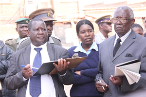High Court Judge Justice Chinembiri Bhunu (left) and assessor Mr Patrick Musengezi during the inspection in loco at Glen View 3 Shopping Centre in Harare in 2012