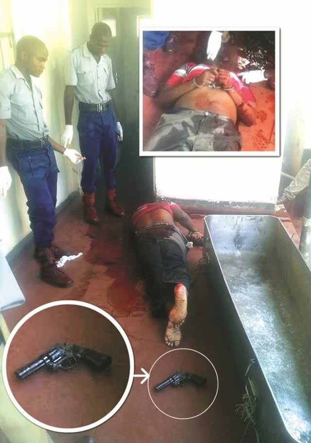 Police details inspect the body of Simbarashe Muchengeti after he shot himself at Shurugwi Central Police Station on Thursday evening