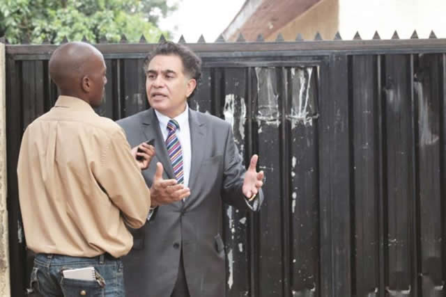 YOU DON’T BELONG HERE . . . Trevor David Carelse-Juul talks to a journalist outside Zifa House at 53 Livingstone Avenue, after being locked out of the premises yesterday after going there to check the Electoral Roll