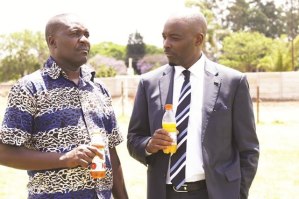 CAPS United president Twine Phiri (right) and coach Taurai Mangwiro chat at the club's training ground in Harare 