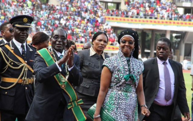 President Mugabe and the First Lady Amai Grace Mugabe greet the crowd on arrival at the National Sports Stadium in Harare yesterday. —(Picture by Tawanda Mudimu)