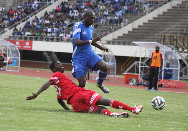 ZPC Kariba defender Ephraim Mwinga stalking Dynamos forward Simba Sithole during their Castle Lager Premiership tie at the National Sports Stadium