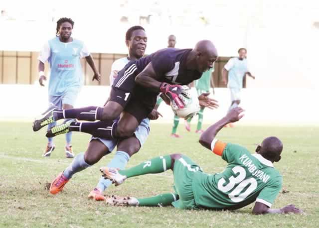 CAPS United ‘keeper Tafadzwa Dube collects the ball under pressure from Triangle forward Felix “Mbesuma” Kuswatuka while the Green Machine skipper Tapuwa Khumbuyani dives in for protection during their Castle Lager Premiership tie at the National Sports Stadium yesterday. — (Picture by Tawanda Mudimu)