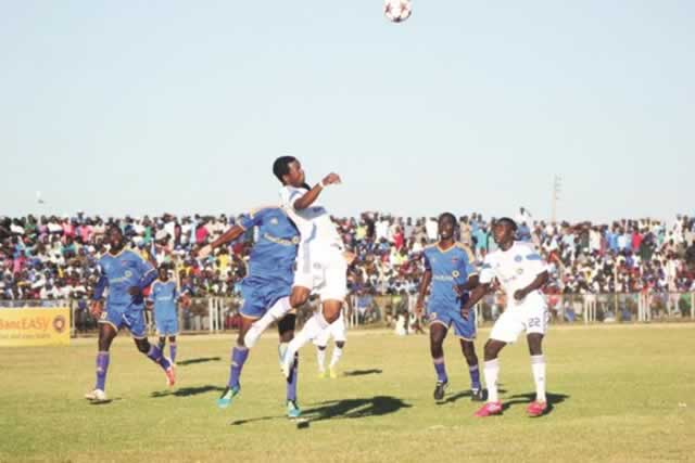 Dynamos centre-back Partson Jaure clears the ball under pressure during yesterday’s Castle Lager Premiership tie against Chapungu at Ascot. — Picture by Paul Mundandi