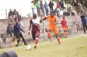 THE RACE IS ON . . . Shabanie Mine right-back Godknows Murwira battles for possession with Chiredzi midfielder Abel Gwatidzo in a Castle Lager Premiership tie at Maglas yesterday