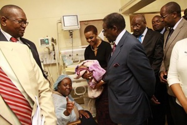 President Mugabe and the First Lady Amai Grace Mugabe talk to the mother of the separated conjoined twins Agnes Mangoro (centre) while Health and Child Care Minister Dr David Parirenyatwa, head of the surgical team MR Bothwell Mbuwayesango and the board chairman of Harare Central Hospital Dr Douglas Gwatidzo look on at Harare Children’s Hospital yesterday
