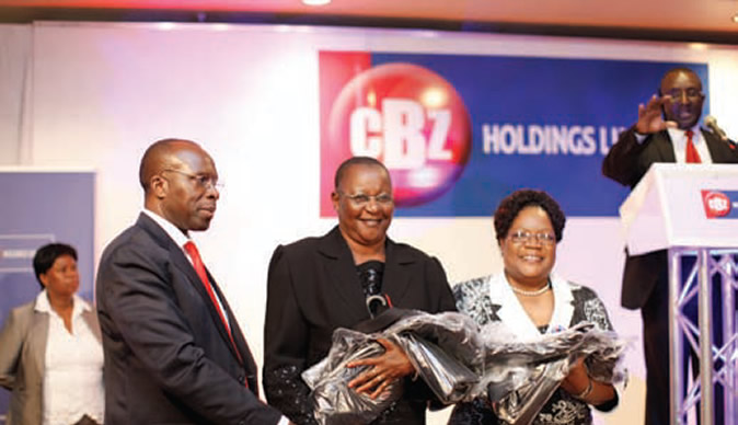 Vice President Joice Mujuru (right) at a CBZ Holdings function