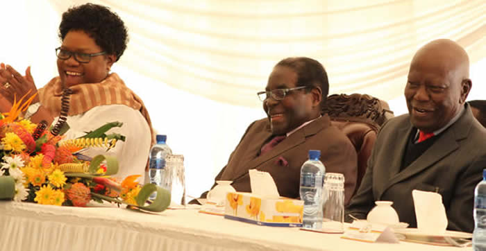President Mugabe flanked by Vice President Joice Mujuru and acting Zanu-PF national chairman Cde Didymus Mutasa share a lighter moment during celebrations to mark the party’s victory in last year’s elections at State House yesterday. — Pictures by Tawanda Mudimu