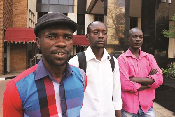 AGGRIEVED: Itai Dzamara (left) and fellow activists of the Occupy Africa Unity Square protest, have vowed to continue with their sit in until their demands are met by President Robert Mugabe. (Picture by Daily News)