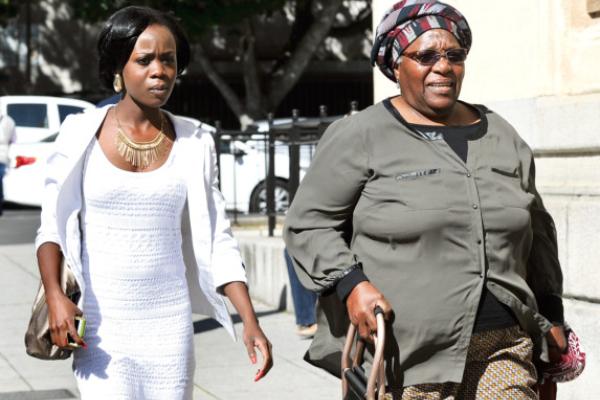 PAINFUL MEMORIES: Archbishop Emeritus Desmond Tutus wife Leah, right, walks alongside Tsungai Paidamoyo Gwatidzo outside the Cape Town Regional Court. Picture: LEON LESTRADE
