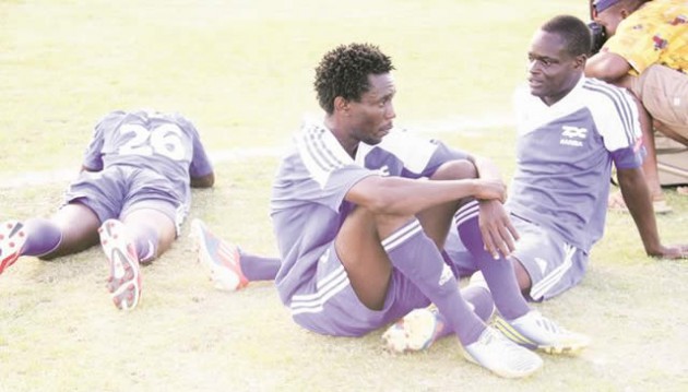 GROUNDED . . . Distraught ZPC Kariba players Peter Muzondo (left) Dexter Phiri and Ephriam Mwinga (lying face down) mourn their defeat to CAPS United which blew their championship hopes