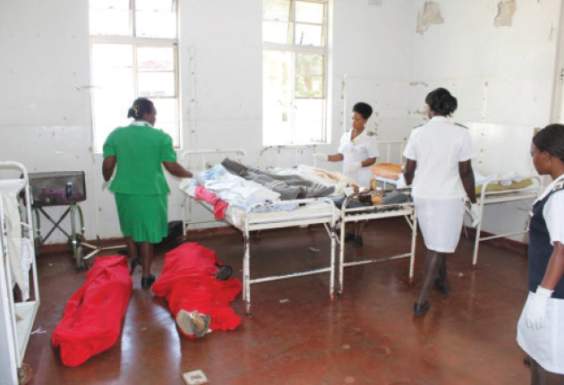 Nurses at Kwekwe District Hospital attend to those injured at the crusade while bodies await collection